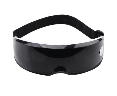 Rechargeable wireless eye massager in black and white, front view with silicone magnetic nodes to help support relaxed eyes.