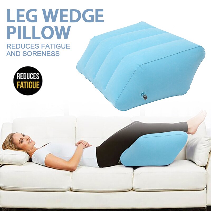 Soft inflatable leg elevation pillow in blue shown front on, velvet-coated PVC with double air valve for adjustable height and comfort.