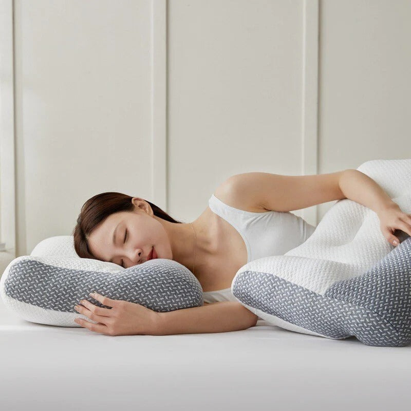 Ergonomic pain relief pillow, hero front view, contoured for neck support with breathable fibre fill and removable washable outer cover.