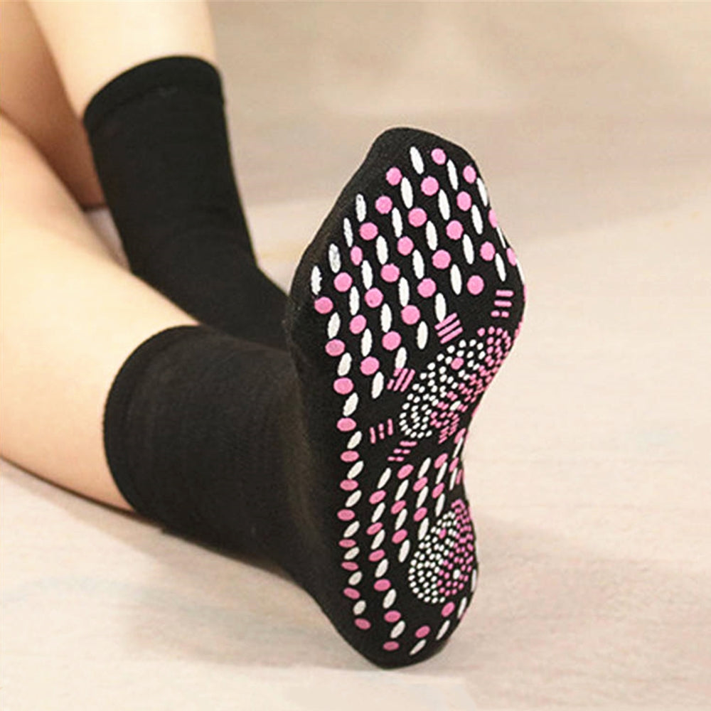 Self-heating thermal socks hero view showing tourmaline-patterned sole in black variant, designed to help keep feet warm during daily movement.