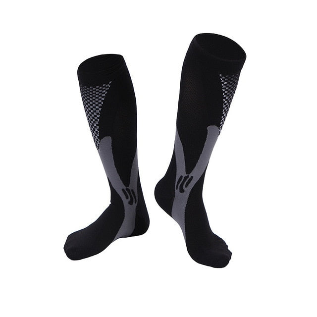 AMS knee-high compression socks, hero angle, showing graduated 20–30 mmHg knit designed to support circulation for sport, travel, and long workdays.