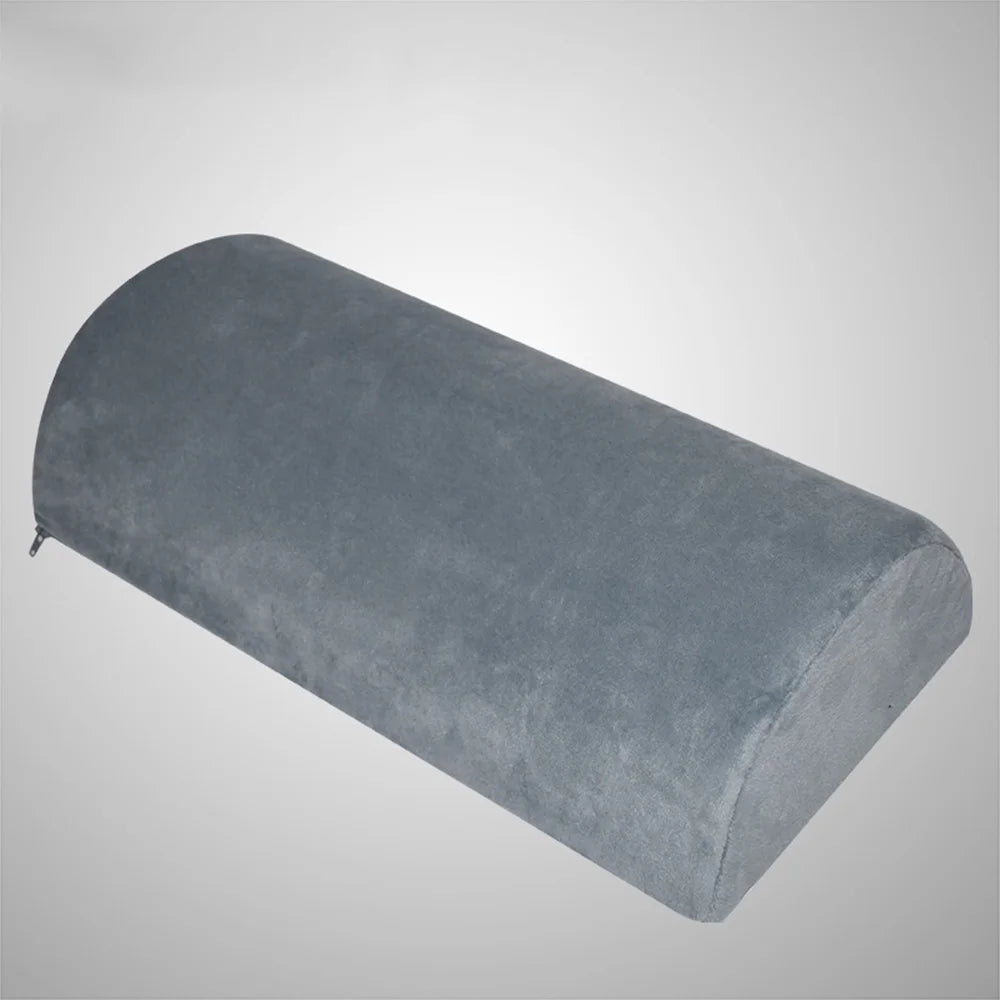 Memory foam under-desk foot rest in teardrop shape shown from front angle with plush cover to support feet and legs.