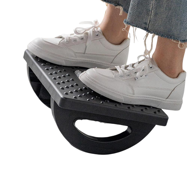 Under-desk ergonomic footrest rocker in black, front hero view, showing textured surface and central massage roller that helps support foot comfort.