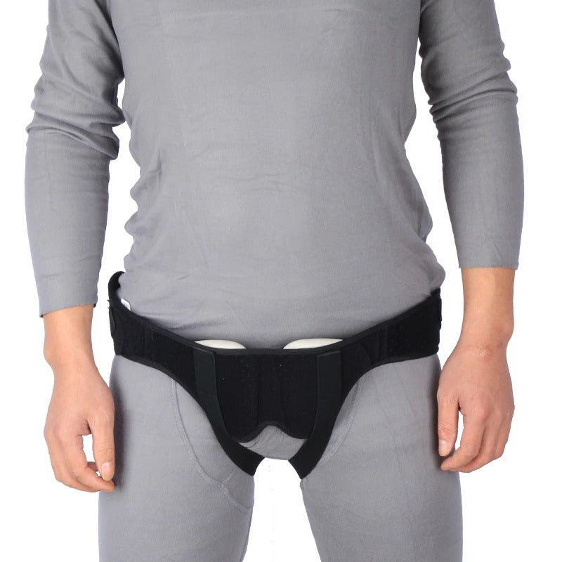 Adjustable hernia support belt in hero view with two removable compression pads and anti-slip silicone strip for discreet groin support.