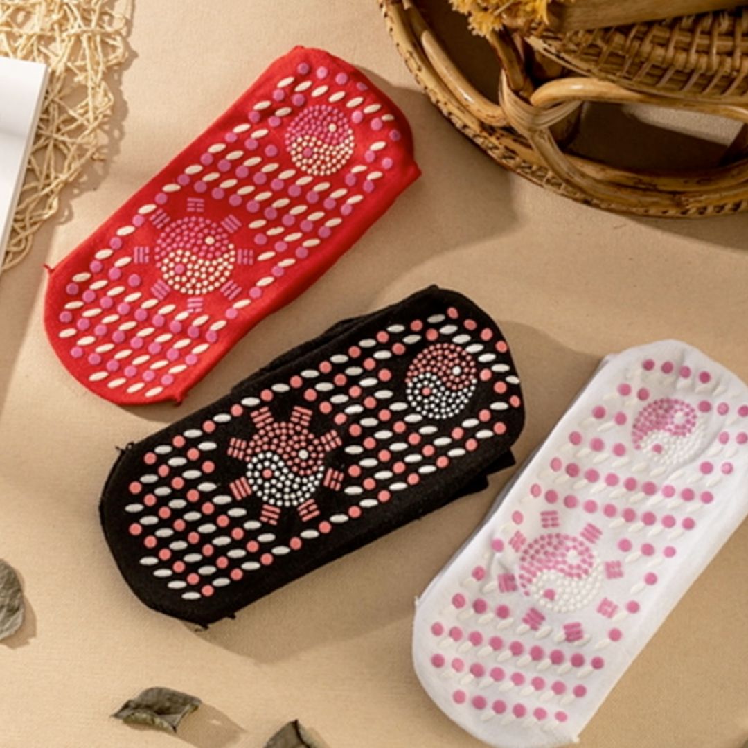 Self heating magnetic socks in black tourmaline fabric view, showing textured sole to help support warm, comfortable feet.