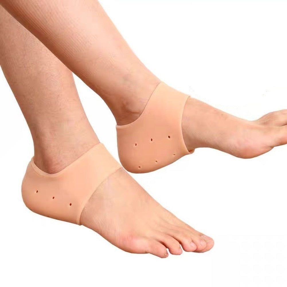 Pair of silicone heel protector pads, front view, showing slim cushioned design with light anti-slip texture for discreet comfort inside everyday shoes.